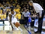 Shaka Smart watches on intently as Darius Theus saves a loose ball versus Hofstra last week.