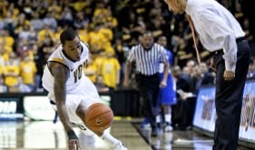 TheusSmart Shaka Smart watches on intently as Darius Theus saves a loose ball versus Hofstra last week.